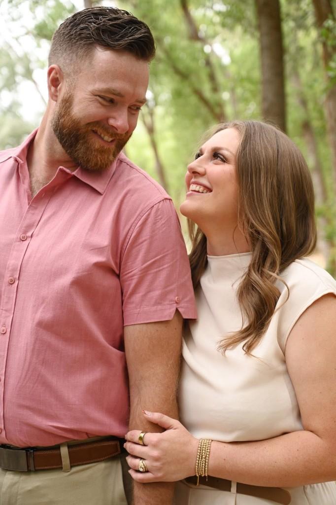 Braeden and Madison Furgeson, the founders of Venn, smiling together in a natural outdoor setting.